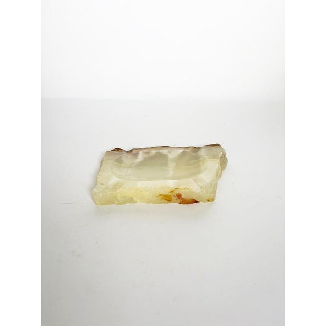 Decorative French ashtray crafted from natural onyx during the 1950s. Carved from a substantial piece of stone, it...