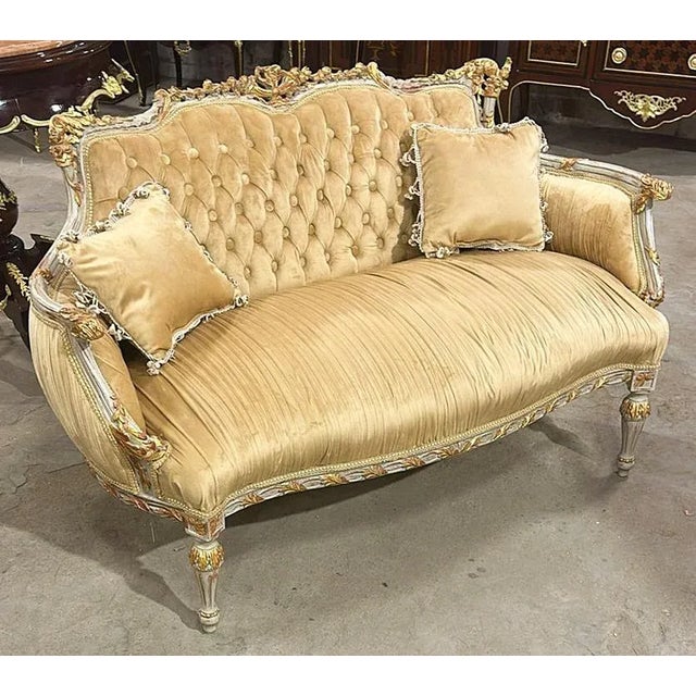 Elegance and comfort assured. Fully refinished in gold leaf and padding. We changed the upholstery to a gorgeous high end...