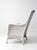This antique white wicker porch chair features a tall sloped back, woven diamond detailing, and a softly aged painted...