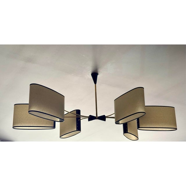 Large brass chandelier with a beige hard paper shade, newly rewired. I can rewire for the United States upon request. I...