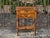 A midcentury English walnut side table, circa 1940–1950, with turned legs and two drawers. This finely crafted piece...