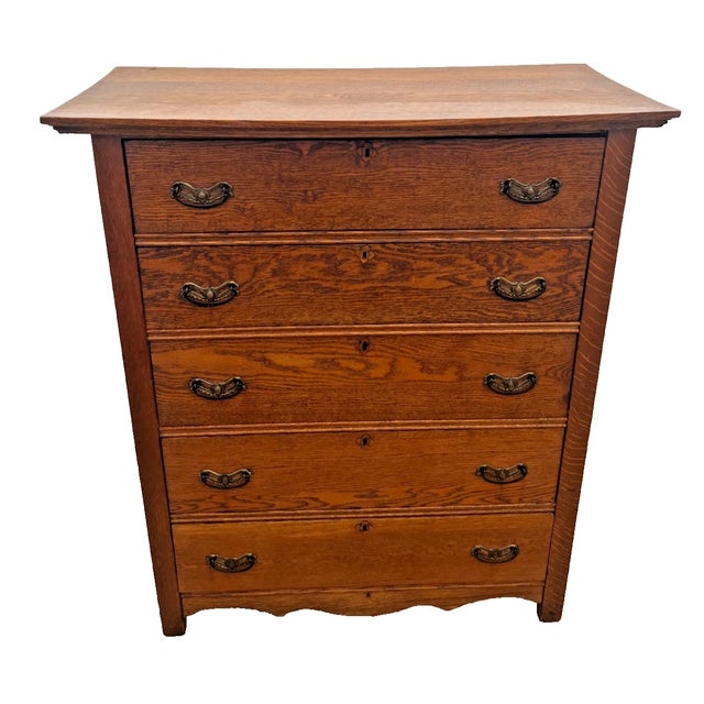 Bring timeless warmth and authentic early-20th-century craftsmanship into your home with this stunning antique 5-drawer...