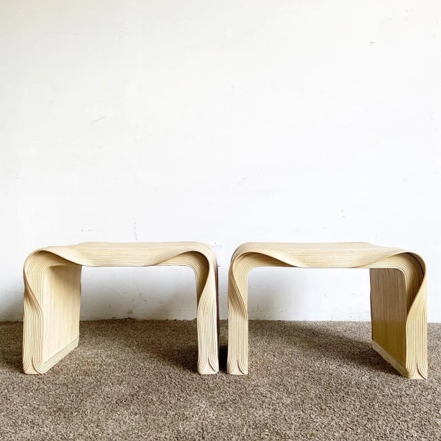 Embrace the allure of bohemian elegance with this pair of Boho Chic Wavy Ribbon Pencil Reed Side Tables. These...