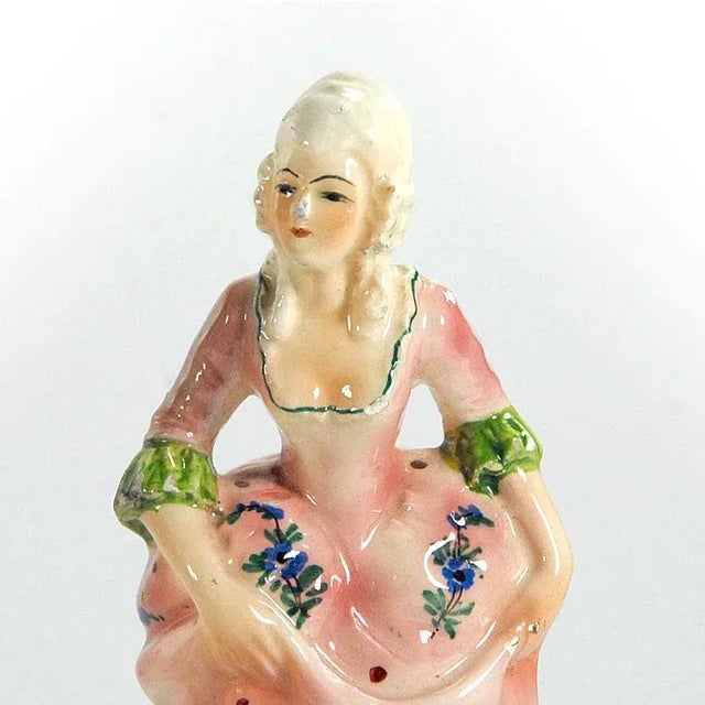 A pair of decorative, hand -painted, Italian figurines made of glazed ceramics. They come from Capodimonte in Naples....