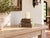 Stand a pillar candle on it and the whole corner changes. This antique teak column base is built in stepped tiers, wide at...
