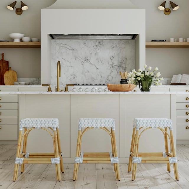 Evoking images of sidewalk tables in the Cote d'Azur, counter stools like this will give your kitchen, dining area, or...