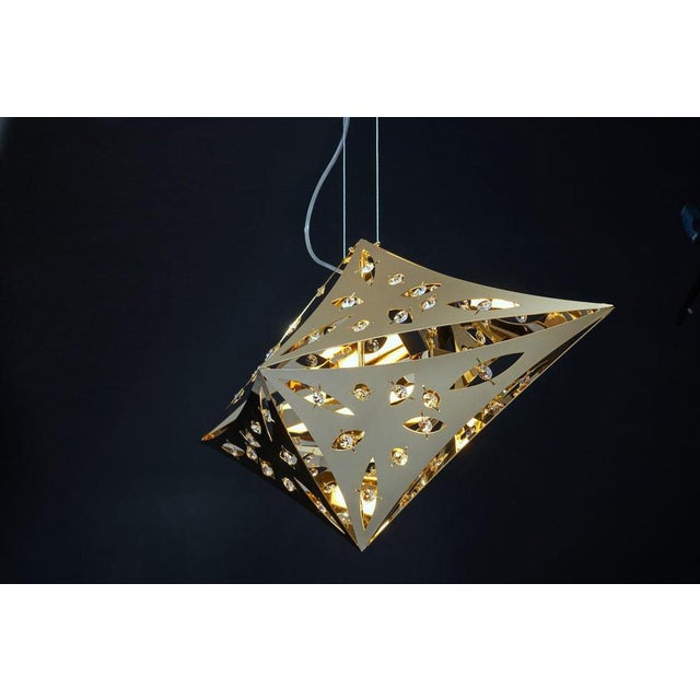 Quasar gold plated horizontal pendant lamp by aggiolight dimensions: d 30 x w 80 x h 40 cm. Materials: gold plated metal,...