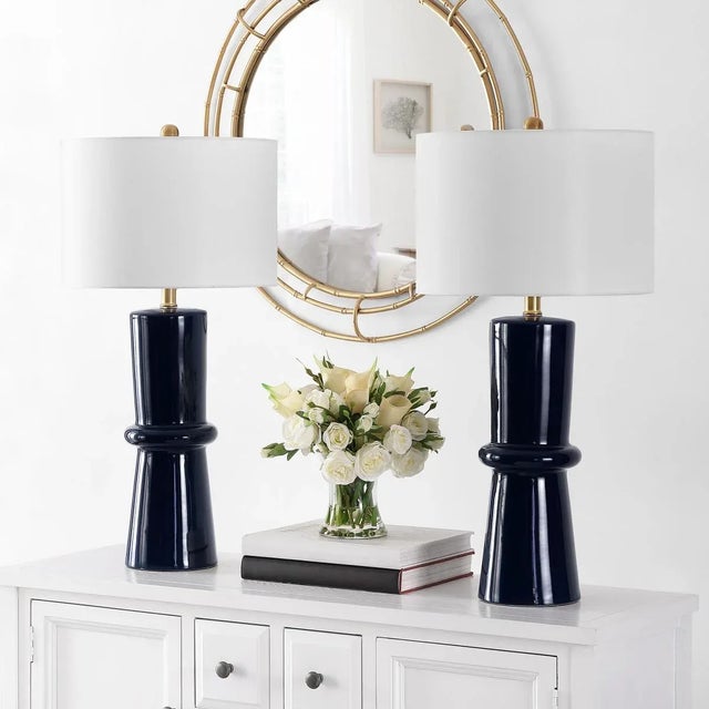 Transform your space with the elegance of the Ellaria 31 inch navy blue ceramic table lamp set. This pair of lamps offers...