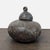 Large cast bronze livestock bell featuring a rounded body, engraved decorative collar, and heavy suspension loop. Rich...