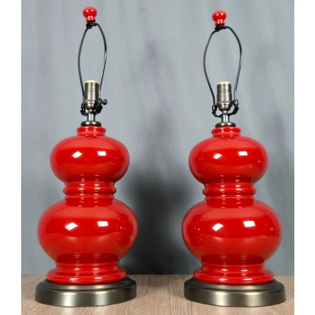 Matched pair of table lamps in a deep red glaze over double gourd form. From Pottery Barn, marked on the bottom as shown....