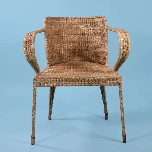 Low Back Arm Chair by Mario Lopez Torres. There are minor imperfections to the hand-made woven rattan. Signed Mario Lopez...