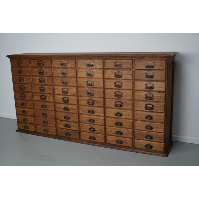 This unique filing cabinet / bank of drawers was designed and made around the turn of the century in France. It was made...