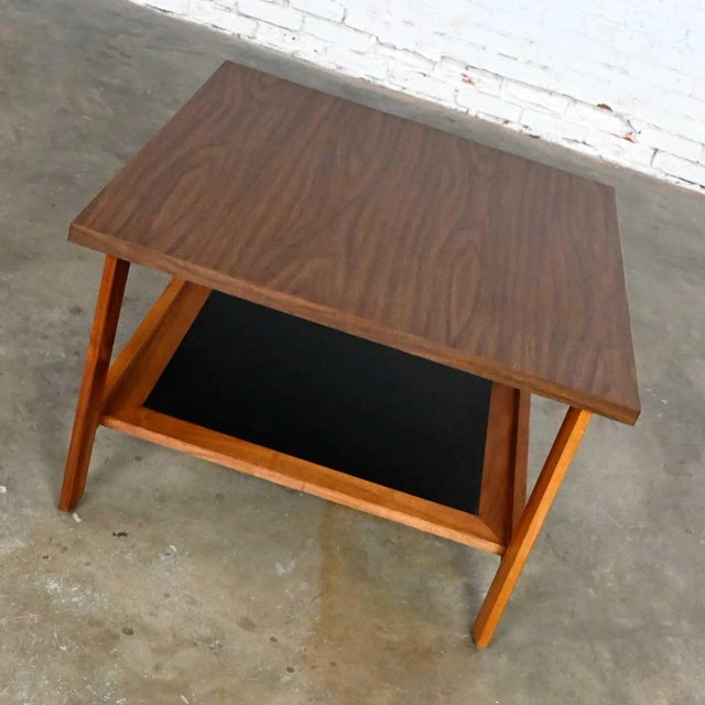 Wonderful mid-century modern square walnut end table lower shelf with a black laminate insert, and laminate top. Beautiful...