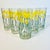 This set of 6 glasses from the 1970s are by designer Jane Lynn. They feature dark green stems of yellow Daffodils on a...