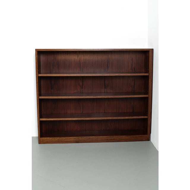 Bookcase for use in right corner. This rosewood veneer cabinet hasn’t got the right finish on its right side so it is most...