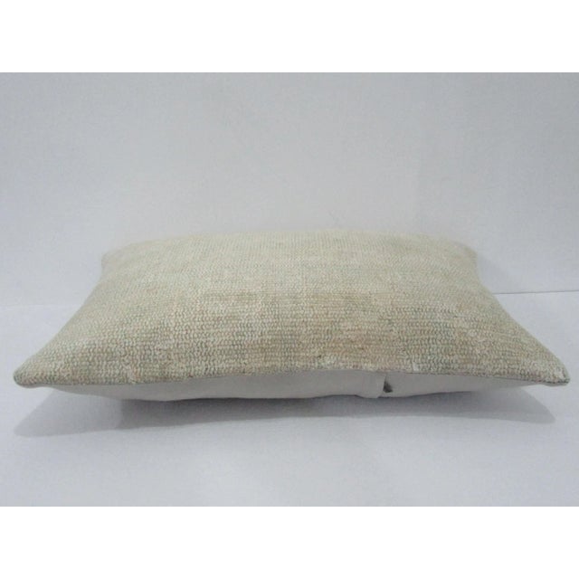 Decorative pillow cover made from a vintage Turkish handknotted rug. Backed with good quality cotton fabric. Pillow...