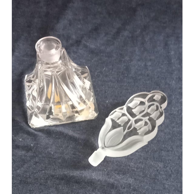 So very vintage! Look at the beautiful etched Lily of the Valley Intaglio stopper. The faceted bottle is labeled I. Rice...