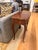 Elegant French Louis XV style side table featuring a shaped serpentine form, graceful cabriole legs, and beautifully...