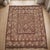 A large handwoven Afghan kilim in a soft camel and chocolate palette, built on a concentric plan that is unusual among...