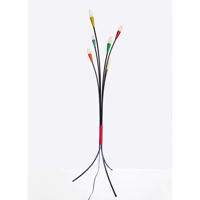 This midcentury Italian multi-color six-arm sputnik floor lamp features plastic cones on the ends in different colors. It...