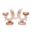 This set of two vintage dolphin votive holders features a soft satin pink glass finish and a sculptural mid-century...