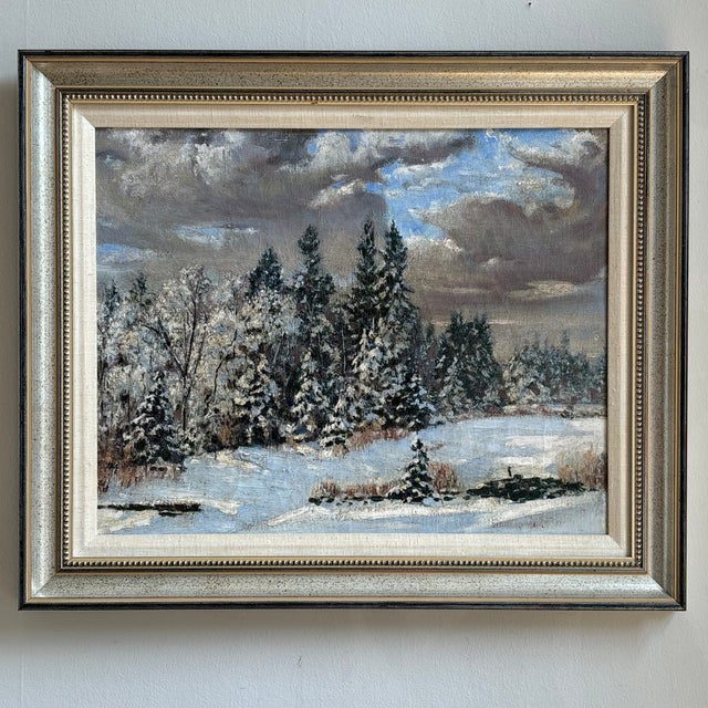 Offerng a stunning winter landscape from the late 1930s. This beautiful vintage oil painting depicts a winter scene with...