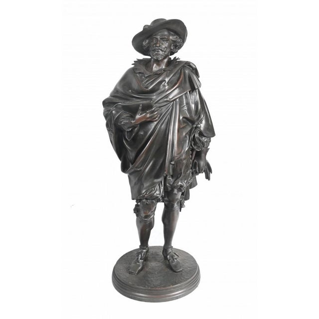 A gorgeous pair of antique French bronze statues They each depict the famous Dutch / Flemish Grand Master artists Rubens...