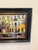 Charming and vibrant, impressionistic oil painting. Set in France, a bustling café terrace beneath a grand classical...