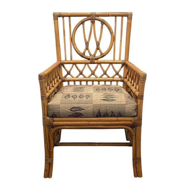Beautiful vintage armchair by Palecek, crafted in sculptural bent rattan and bamboo with intricate wrapped joints and...
