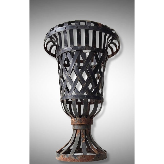 Wonderful heavy iron strap urn of riveted construction. France, circa 1900-1920