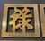 Set of four 4 x 4 inch brass trivets with Chinese characters and scrolling borders. Unmarked, each with a hanging loop.