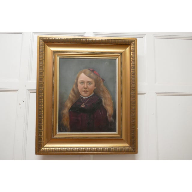19th century oil on canvas portrait of a young girl A Delightful portrayal of a young girl she is seated wearing Purple...