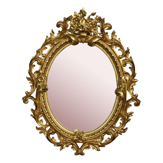 Carved Gilt-Wood Oval Wall Mirror For Sale