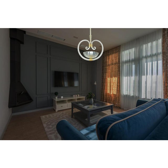 Beautiful glass chandelier, handmade in Murano. The elegant heart shape makes it sophisticated and unique. Period: 1940s...