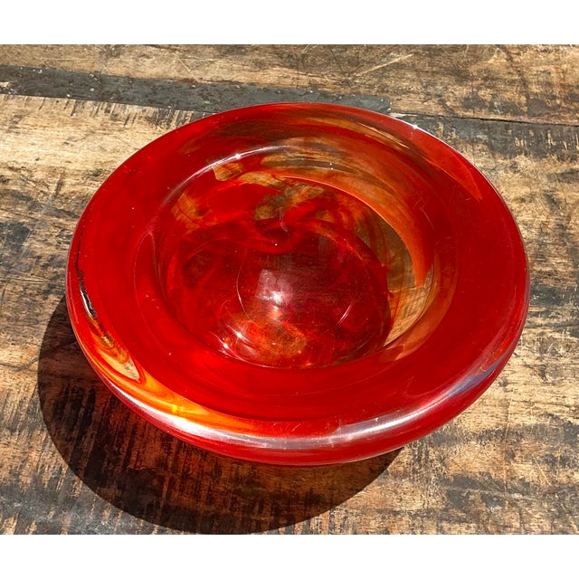 This striking vintage art glass bowl is a vibrant celebration of Mid-Century Modern artistry and master glassblowing...