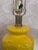 Dramatic pair of vintage yellow table lamps. The lamps have been rewired. They are paired with bold silk Ikat shades...