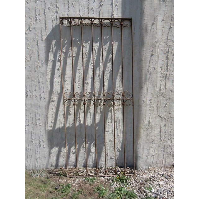 This gate is a wonderful piece of architecture. Heavy, tight, and sturdy. The piece does show signs of age related wear...