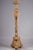 Stand or torchiere holder in gilded wood, molded and carved with shells, scrolls and acanthus leaves on a tripod base....