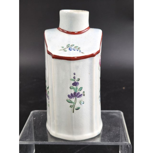 This is an early english pearlware tea canister, made at leeds pottery in hunslet, yorkshire, circa 1780. Its twelve-sided...