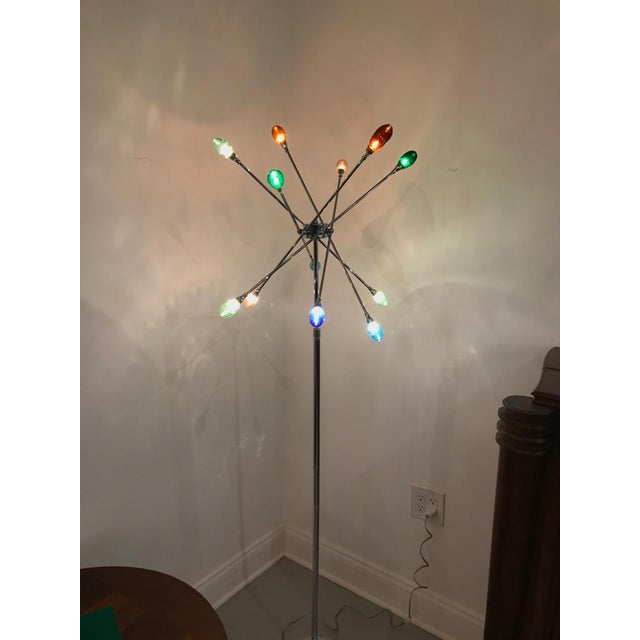 Pair of Mid-Century Modern chrome Sputnik floor lamps. Having adjustable arms with both ends having multi colored glass...