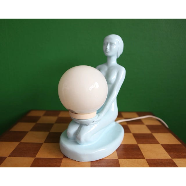 1970s Blue Ceramic Woman Table Lamp Holding a Glass Globe | Chairish