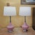 Pair of vintage American-made ceramic table lamps featuring sculptural blush pink bases, chrome-tone necks and bases,...