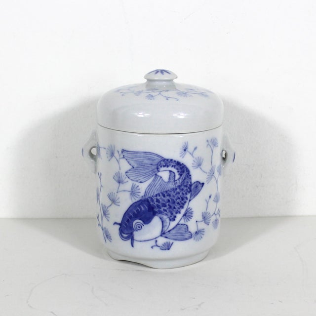 Vintage asian koi fish ceramic lidded canister. Very good vintage condition with some discolouration around the rim and a...