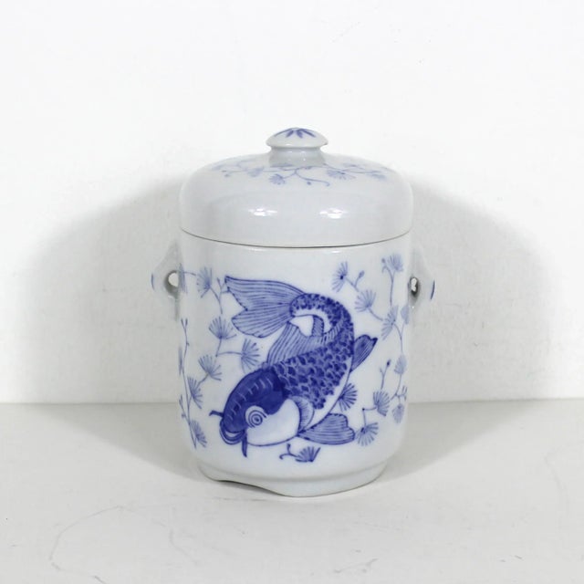 Vintage asian koi fish ceramic lidded canister. Very good vintage condition with some discolouration around the rim and a...