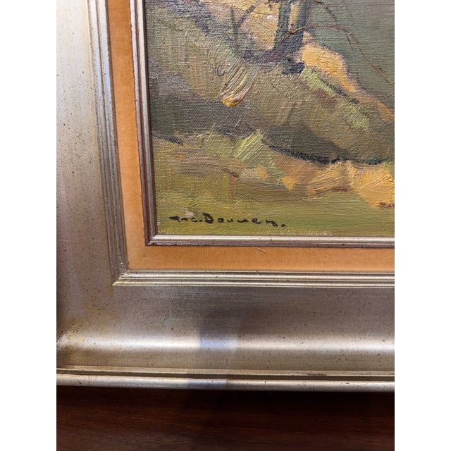 This is oil painting of a rustic watermill set along a quiet stream, surrounded by bare trees and rolling countryside is...