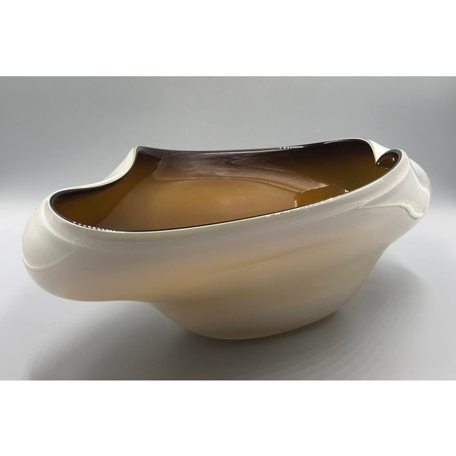 Large bowl in the shape of a boat with organic, elegant lines. The bowl is made of high quality glass. Overlay technique:...