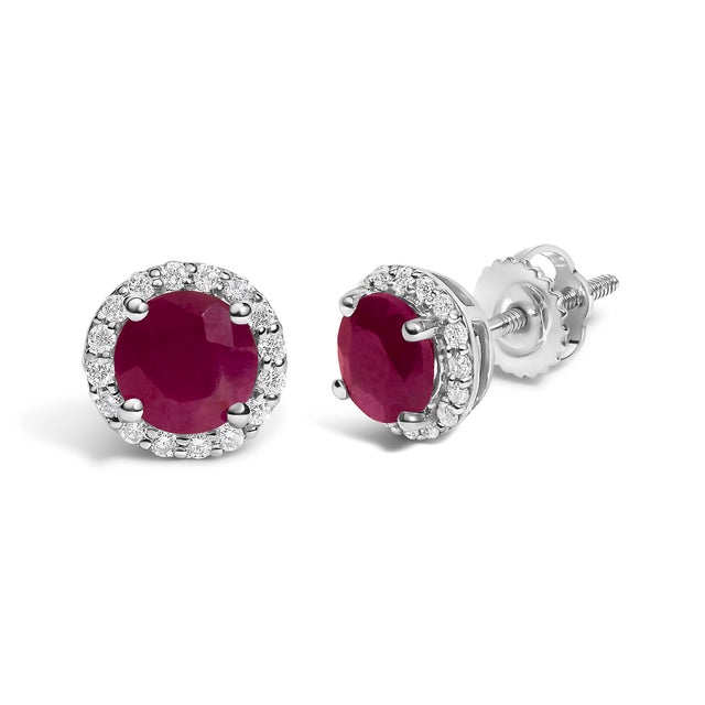Immerse yourself in the allure of these exquisite 10K white gold stud earrings, each centered with a captivating 5mm...