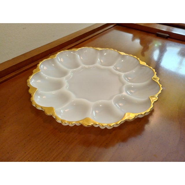 Vintage Anchor Hocking Milk Glass Egg Plate with Gold Trim. Egg plate is in like new condition without chips, cracks or...