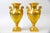 An elegant pair of French Old Paris porcelain decorative vases, inspired by the refined Empire style and richly ornamented...