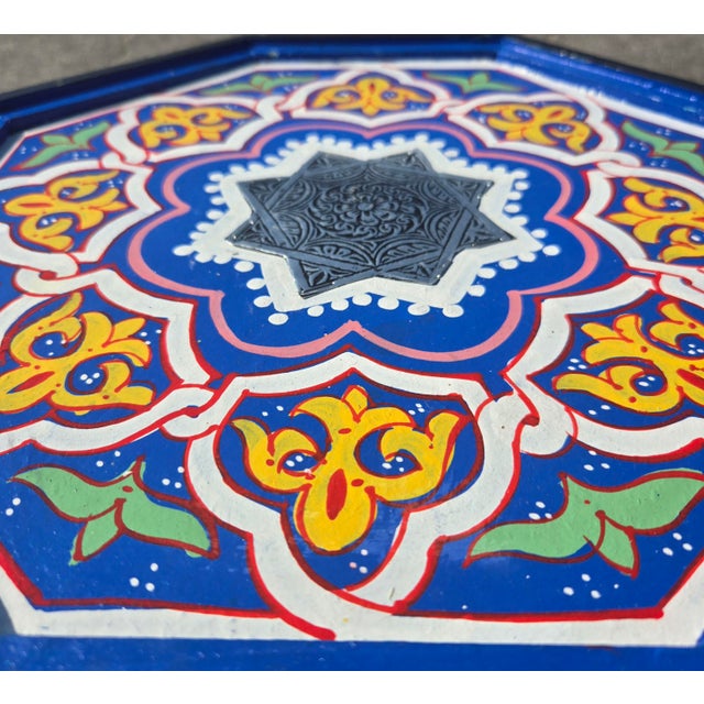 Enhance your home with the timeless beauty of Moroccan craftsmanship with this exquisite hand-painted side table....